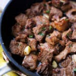 garlic lemon butter steak bites in a skillet