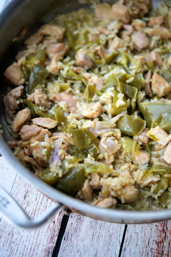 chicken peppers and onions in a skillet