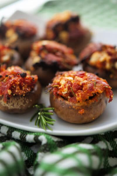 a close up of sun dried tomato stuffed mushrooms