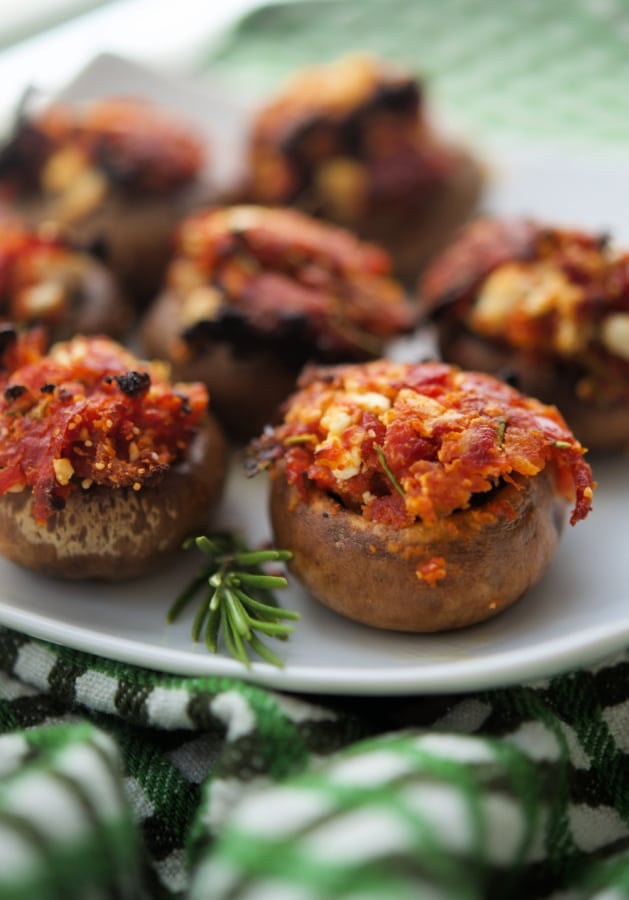 a close up of sun dried tomato stuffed mushrooms