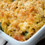 a close up of chicken pot pie casserole in white baking dish