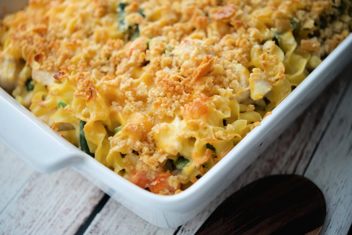 a close up of pot pie casserole in a white baking dish