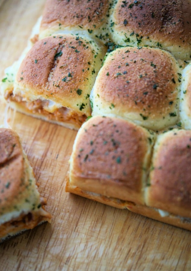 chicken parm sliders on a wooden cutting board