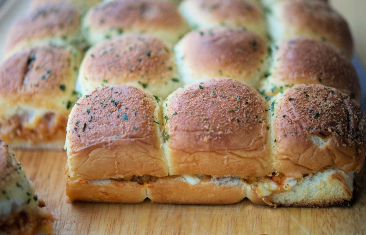 ground chicken parm sliders on a wooden board