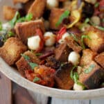 a wooden bowl with italian panzanella salad