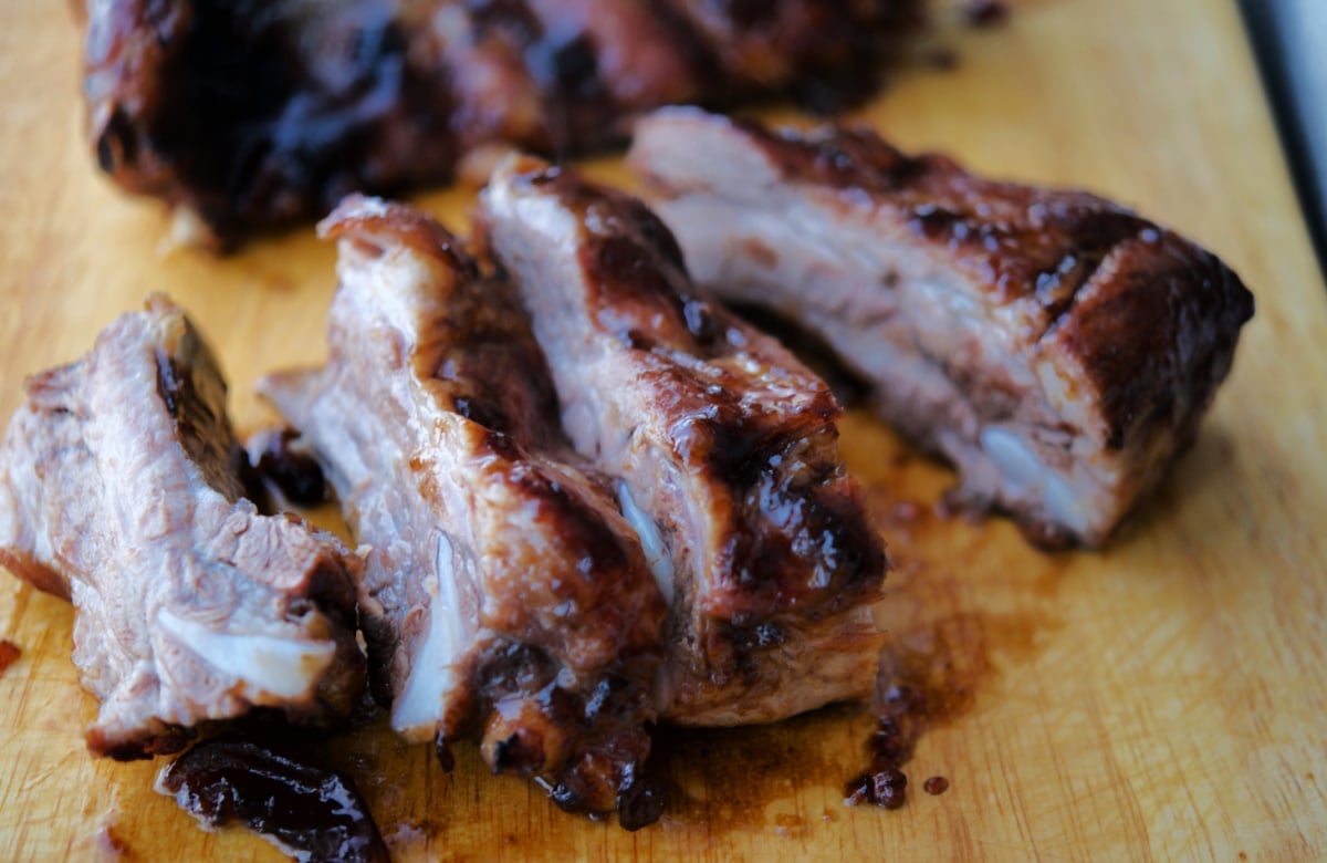 ribs with bbq sauce on a board