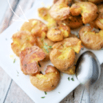 baby smashed potatoes with lemon on a plate