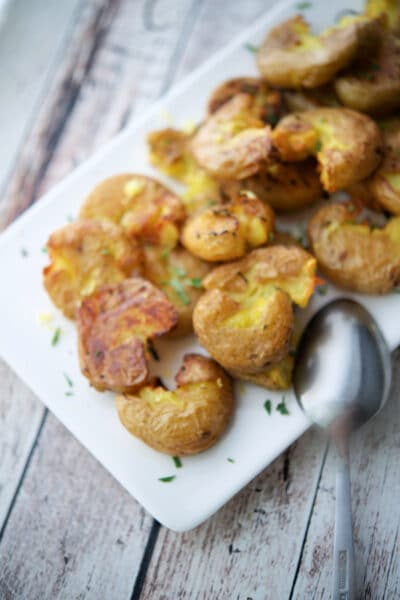 smashed potatoes on a plate