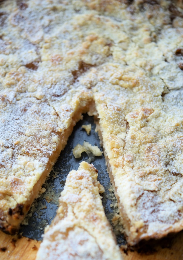 apple pie tart with a piece cut out