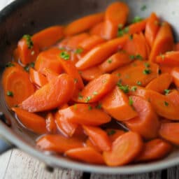 a close up of carrots in a skillet