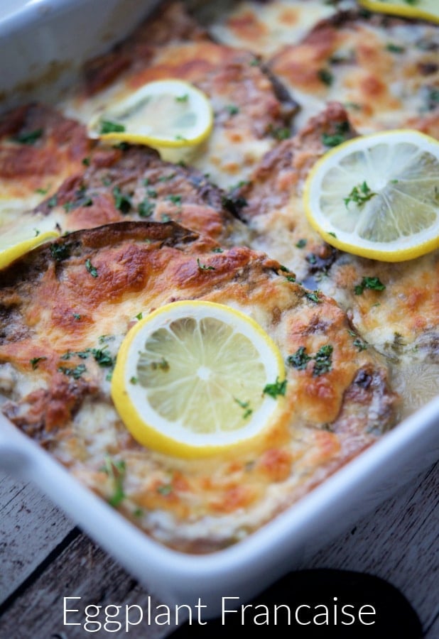 eggplant in a white dish with lemon sauce