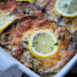 a white baking dish with eggplant francaise