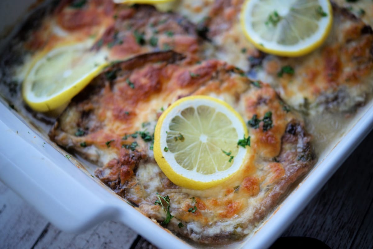 a white baking dish with eggplant francaise