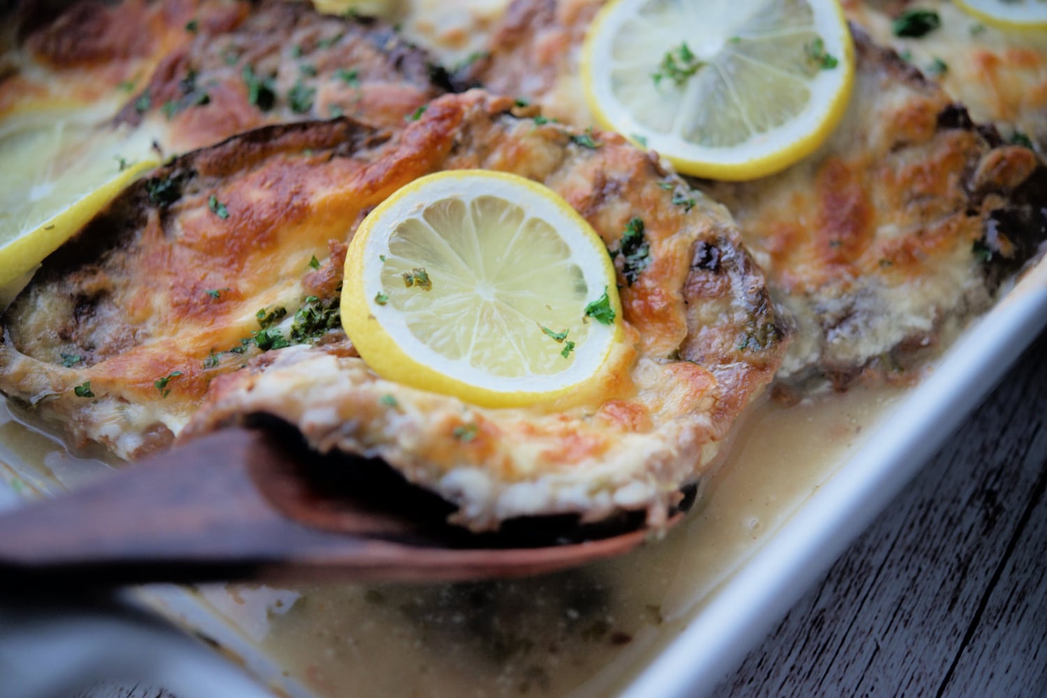 a close up of eggplant francaise on a spoon