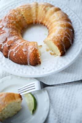 key lime olive oil bundt cake on a white plate