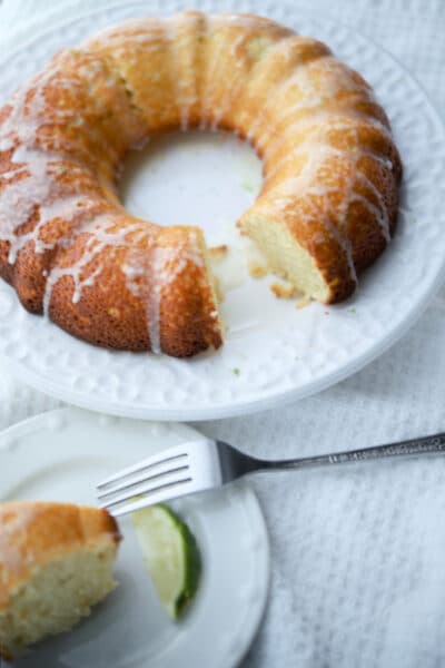 key lime olive oil bundt cake on a white plate