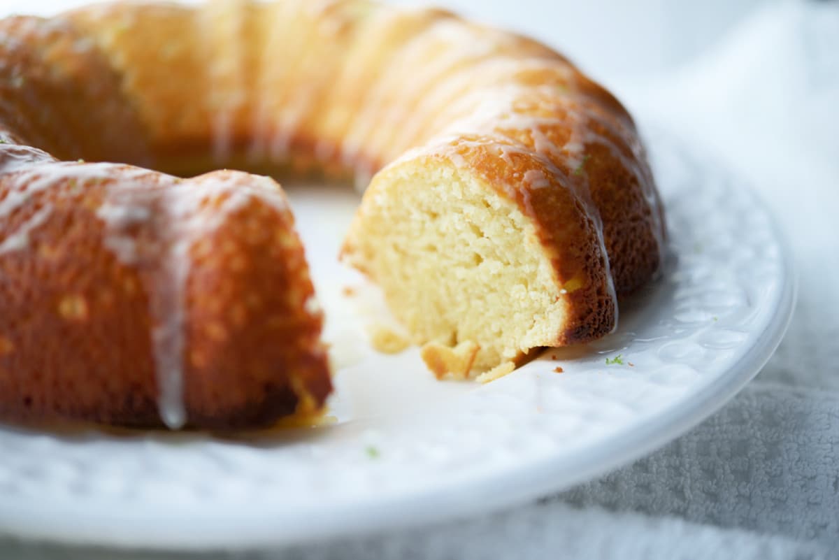 a close up of a piece of lime bundt cake