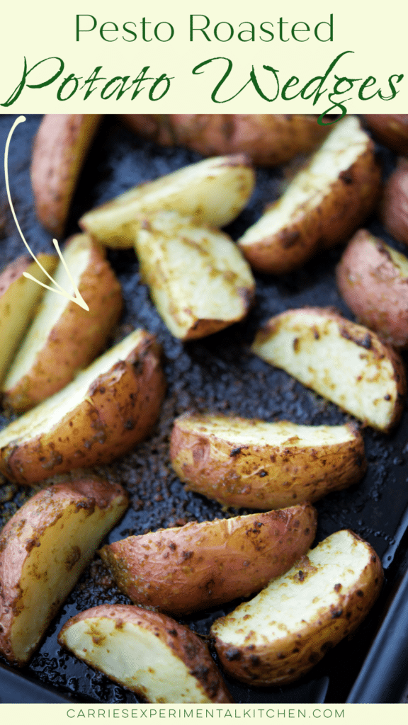 pesto roasted potato wedges on a sheet pan