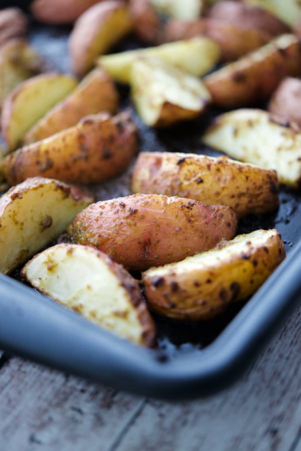 a sheet pan with potato wedges