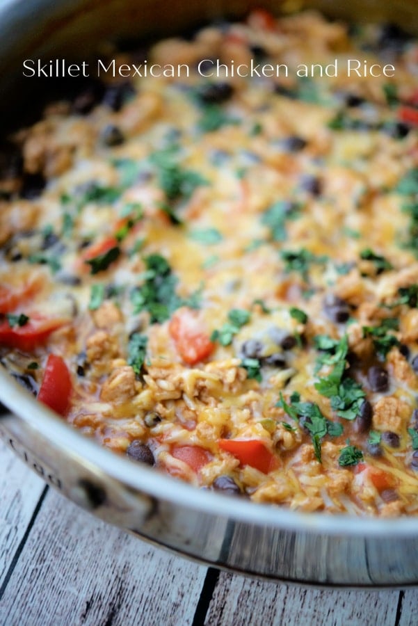 a skillet with chicken and rice