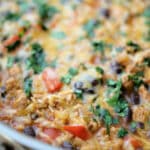 a close up of chicken and rice in a skillet