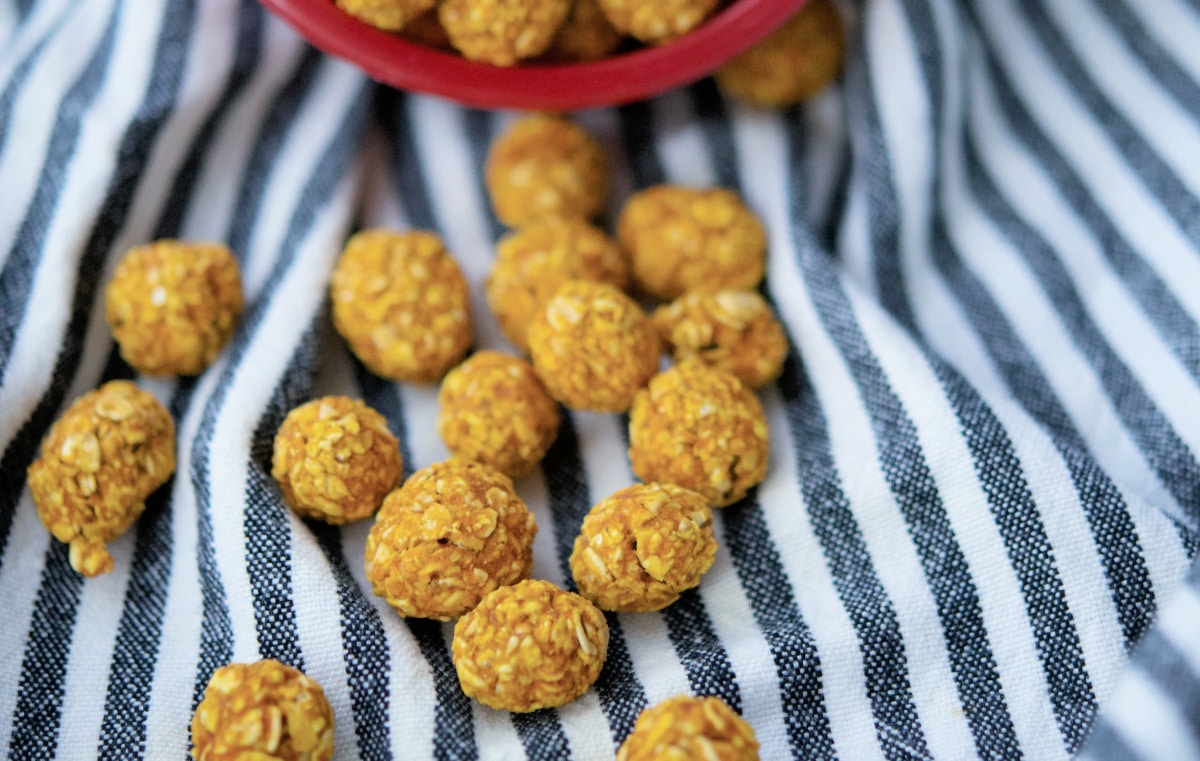 scattered pumpkin treats on a black and white towel