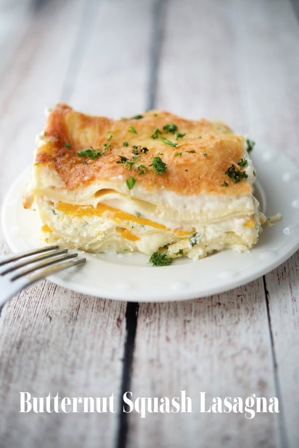 a slice of butternut squash lasagna on a white dish