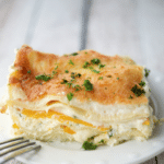 a slice of cooked butternut squash lasagna on a white dish