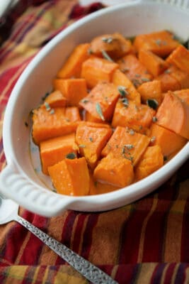 maple roasted sweet potatoes in a white dish