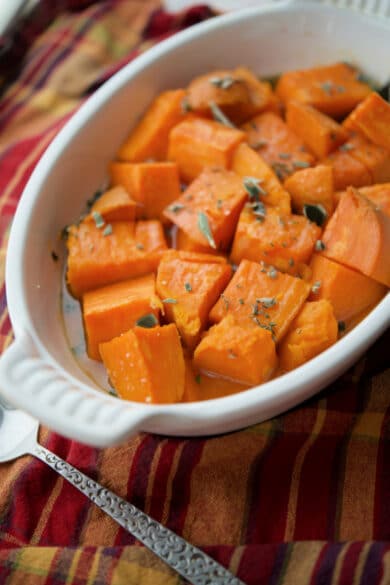 maple roasted sweet potatoes in a white dish