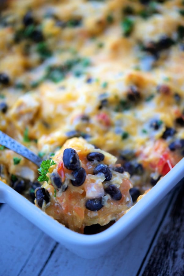 a close up of pico de gallo spaghetti squash casserole on a spoon