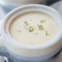 a close up of cauliflower soup in a crock