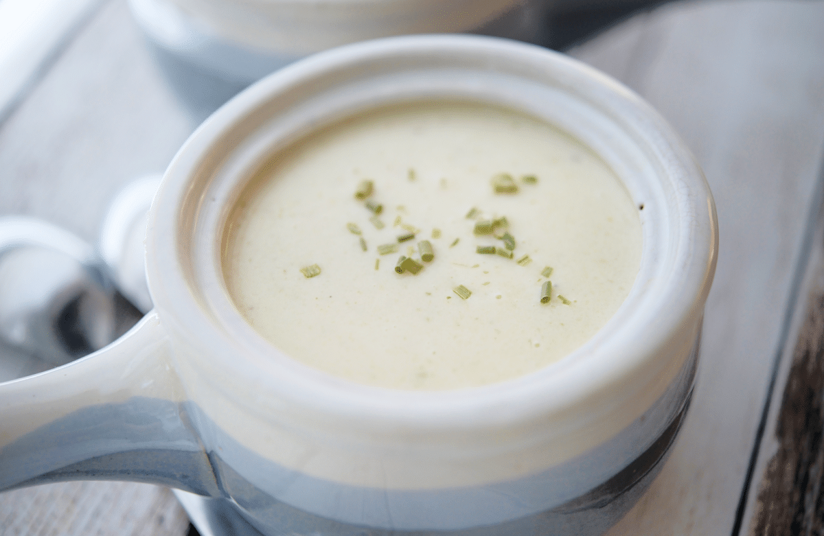 a close up of cauliflower soup in a crock