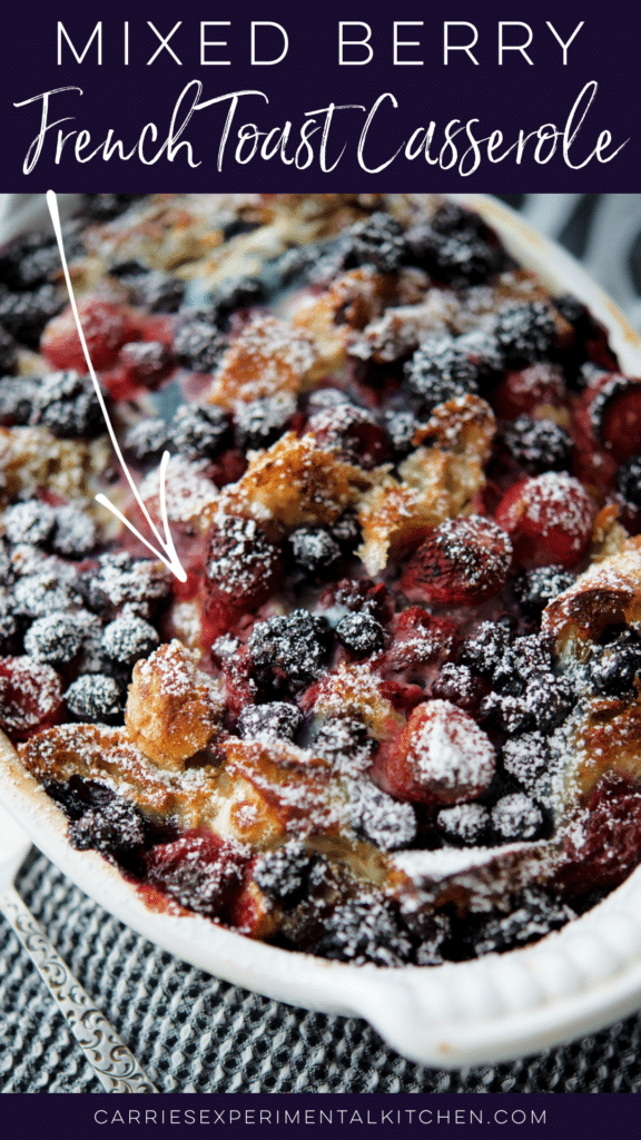 mixed berry french toast casserole in a white dish