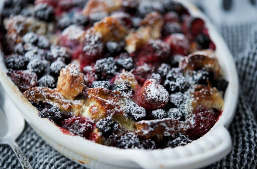 a closeup of berries mixed with french toast