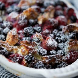 a closeup of berries mixed with french toast