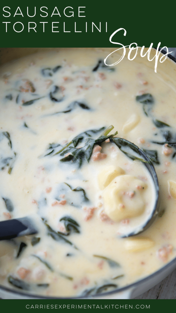 sausage tortellini soup in a pot with a ladle