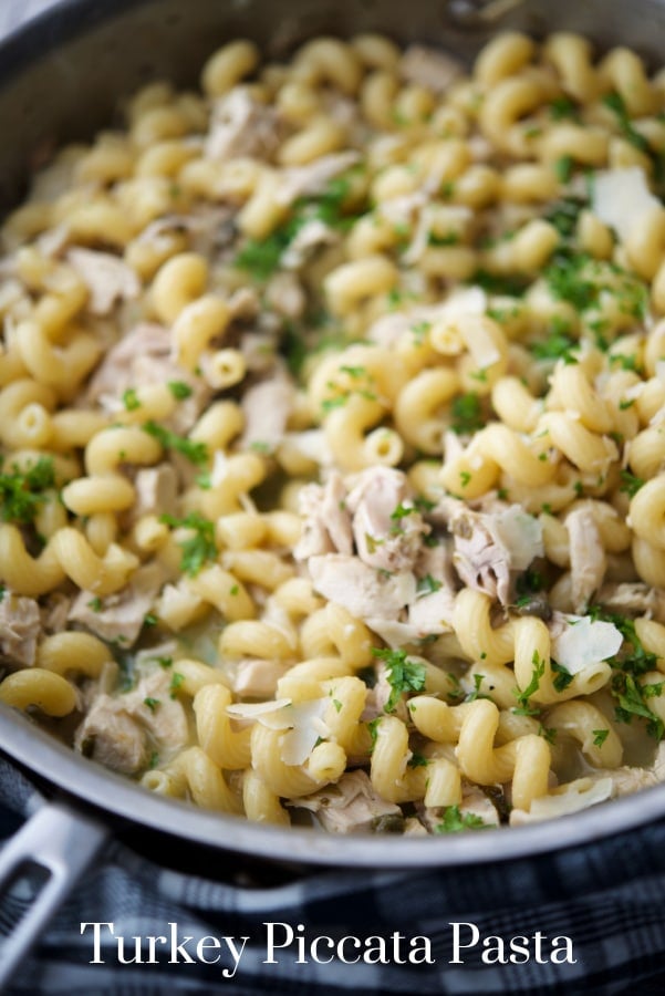 pasta with turkey, lemon juice and capers in a skillet