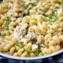 close up of turkey piccata pasta in a skillet