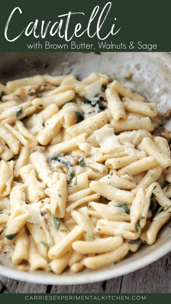 cooked cavatelli pasta in a skillet with walnuts and sage