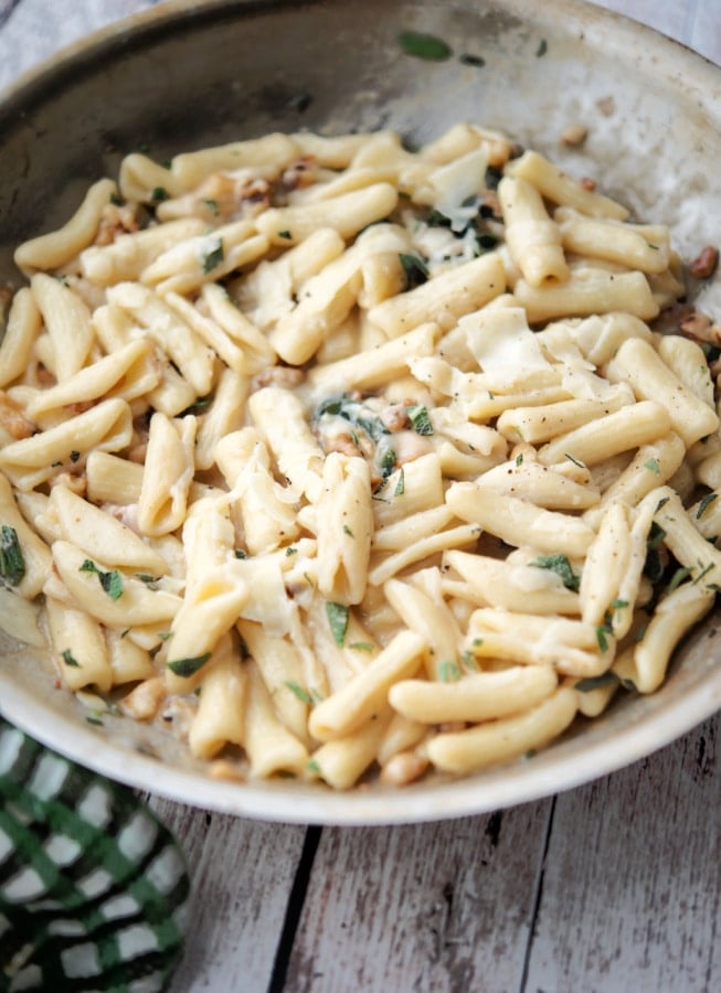 cavatelli in a skillet with walnuts and sage