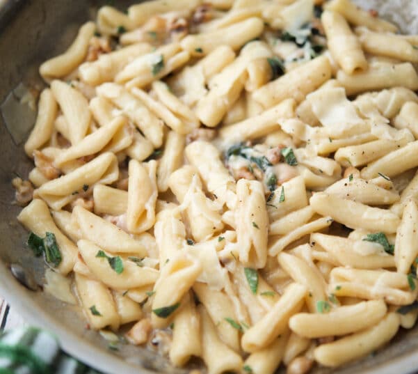 cavatelli in a skillet with sage and walnuts