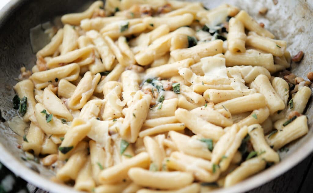 a close up of cavatelli in a skillet