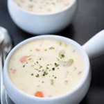 two white soup crocks of chicken pastina soup