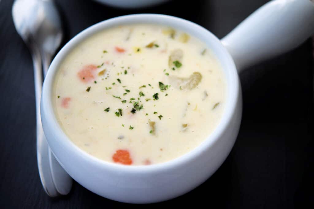 a white crock of chicken pastina soup