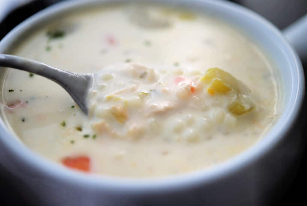 chicken pastina soup with a spoon