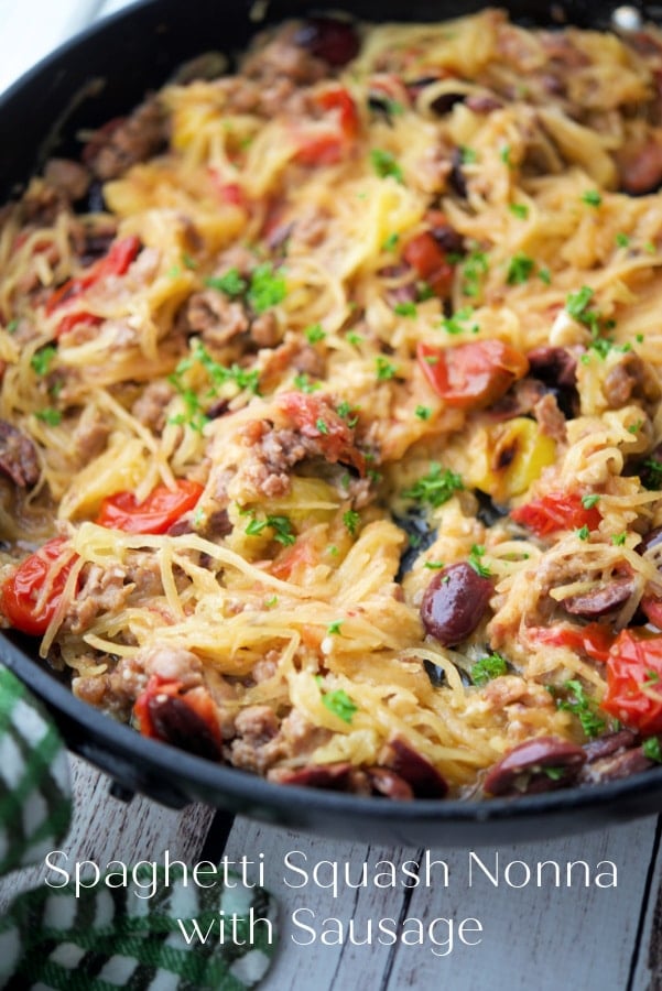 spaghetti squash in a pan with tomatoes and olives