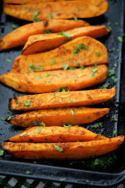 roasted sweet potatoes with a chili lime marinade on a small roasting pan