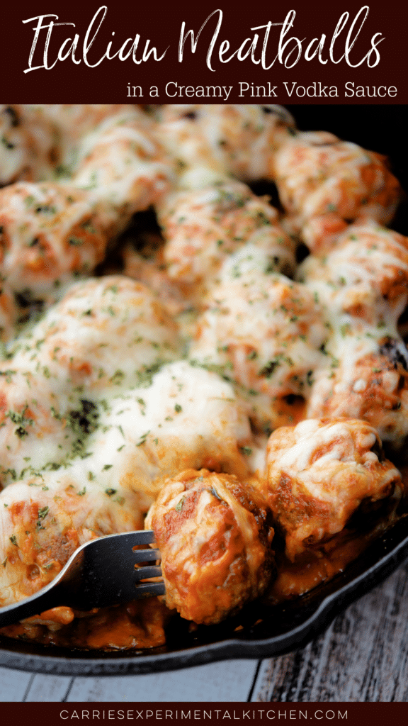 Italian meatballs in a cast iron skillet with vodka sauce and melted cheese