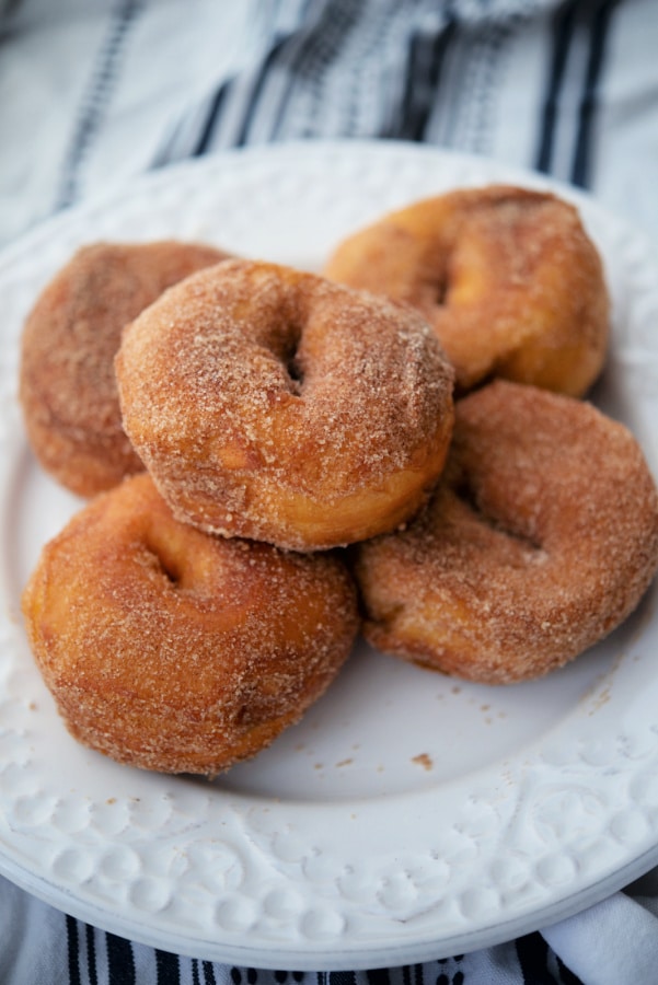 five donuts on a white plate